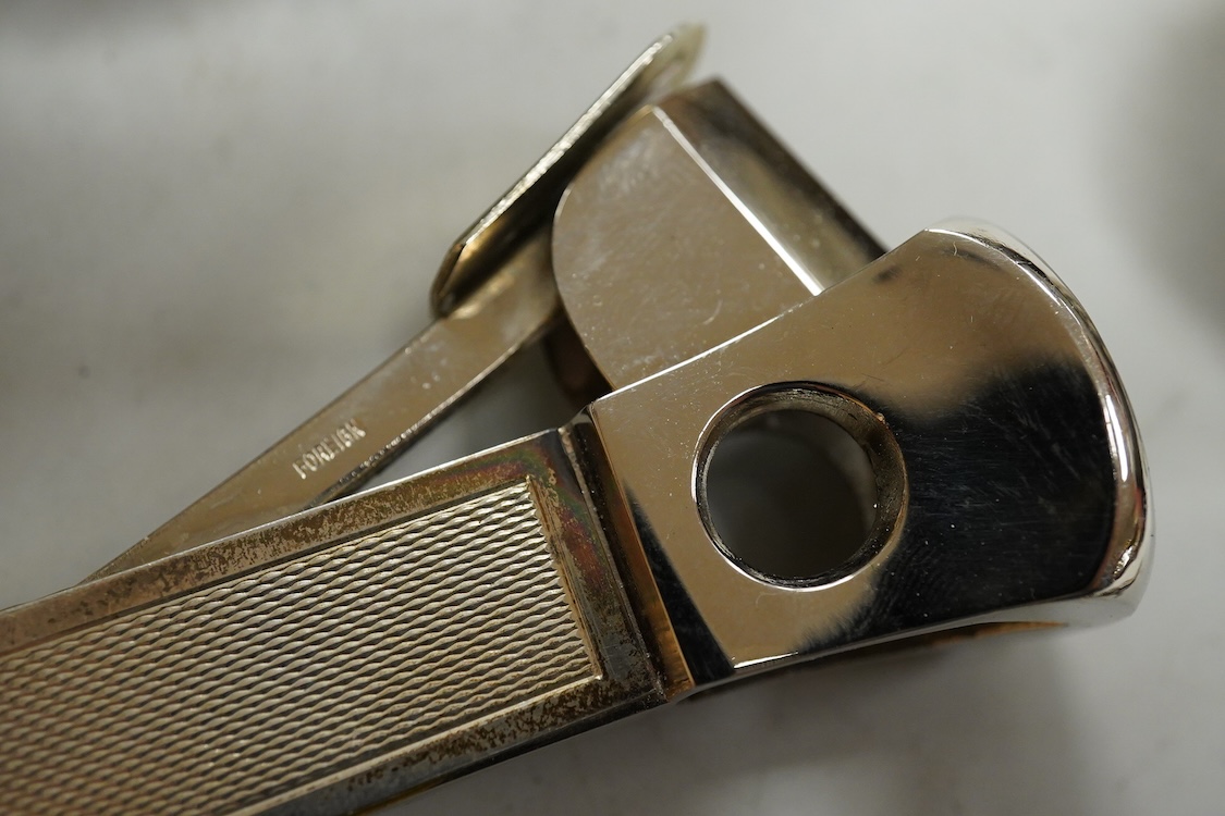 Small silver including two Edwardian caddy spoons, one German with import marks, a George V vesta case, a late Victorian pierced bonbon dish and a modern mounted steel cigar cutter.